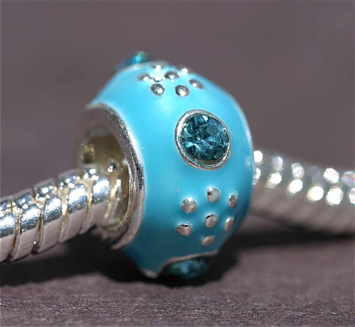 Turquoise rhine bead w/silver Dots